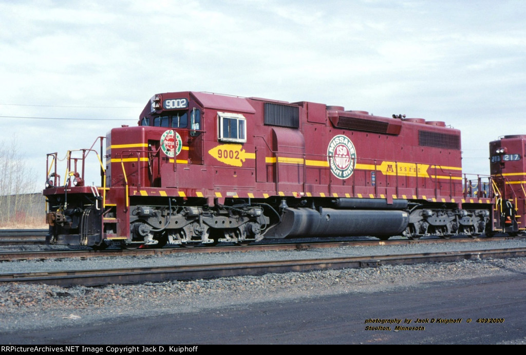 DM&IR ISO 9002 is waiting in the yard at Steelton, Minnesota. April 16, 2000. 